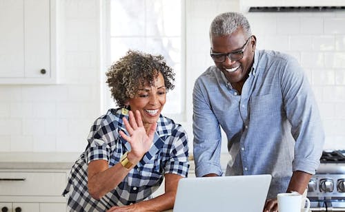 woman and man at computer with support specialist